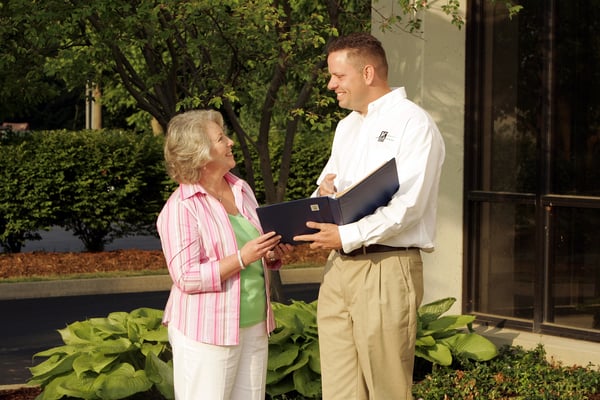 KG Employee Talking with a Happy Customer