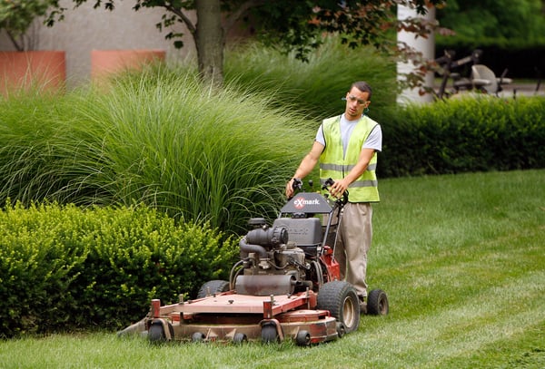 A Klausing Group Employee Mowing Safely